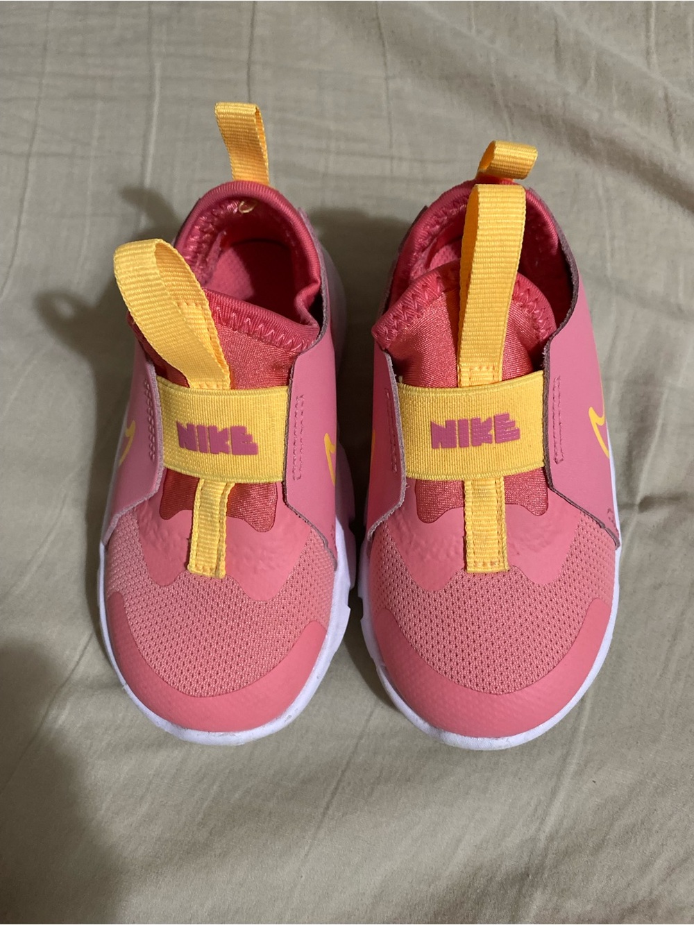 Nike Kids Pink Slip-On Sneakers with Yellow Accents